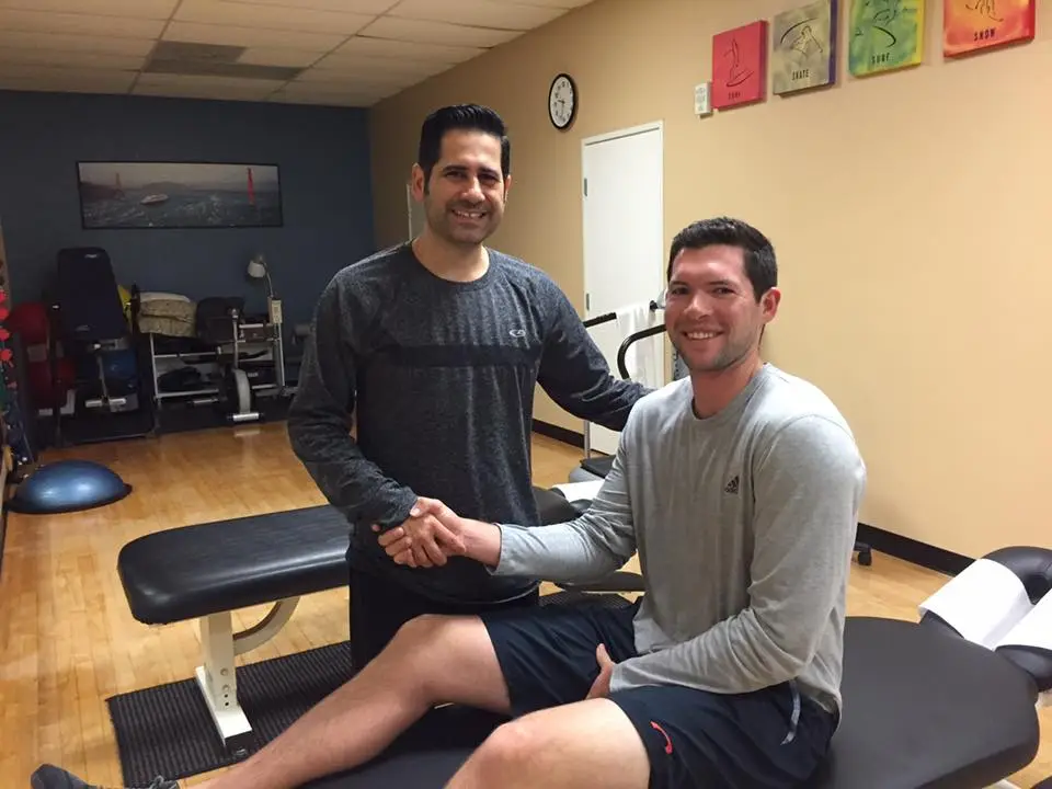 Dr. Jean-Pierre Khreich shaking hands with a happy patient