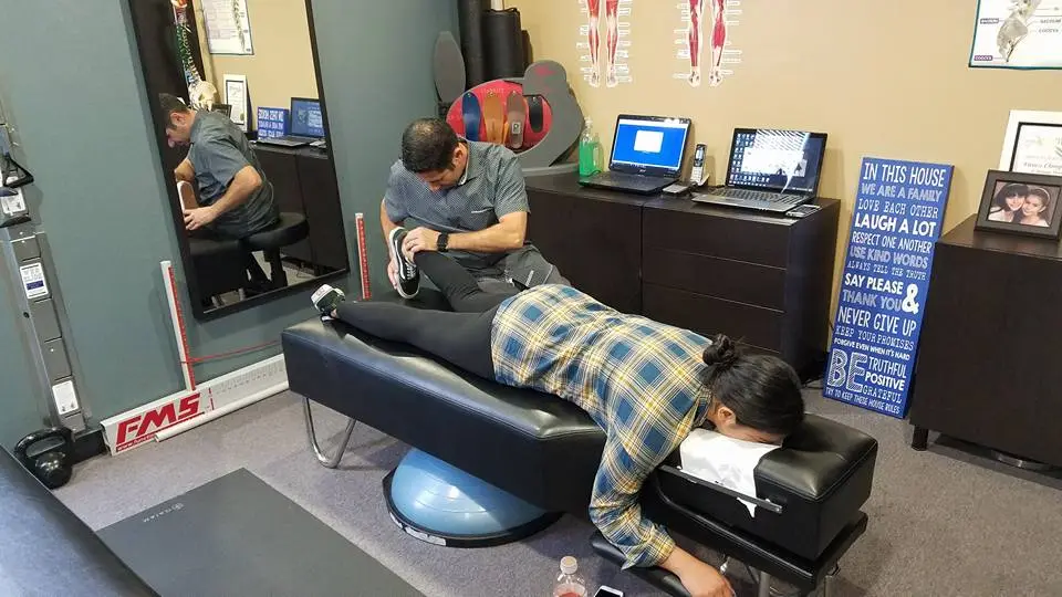Patient receiving an adjustment on a chiropractic drop table