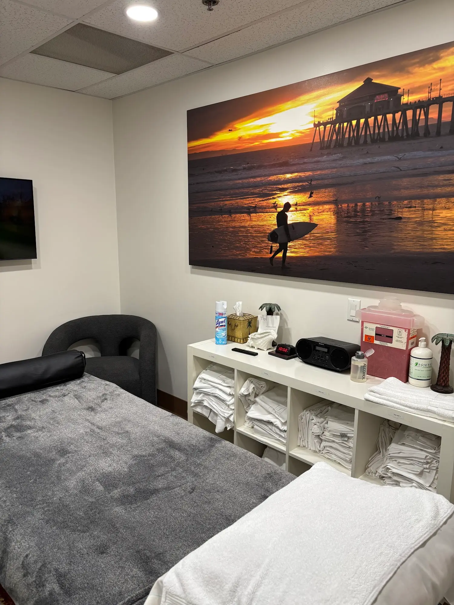 Treatment room with surf artwork in Huntington Beach