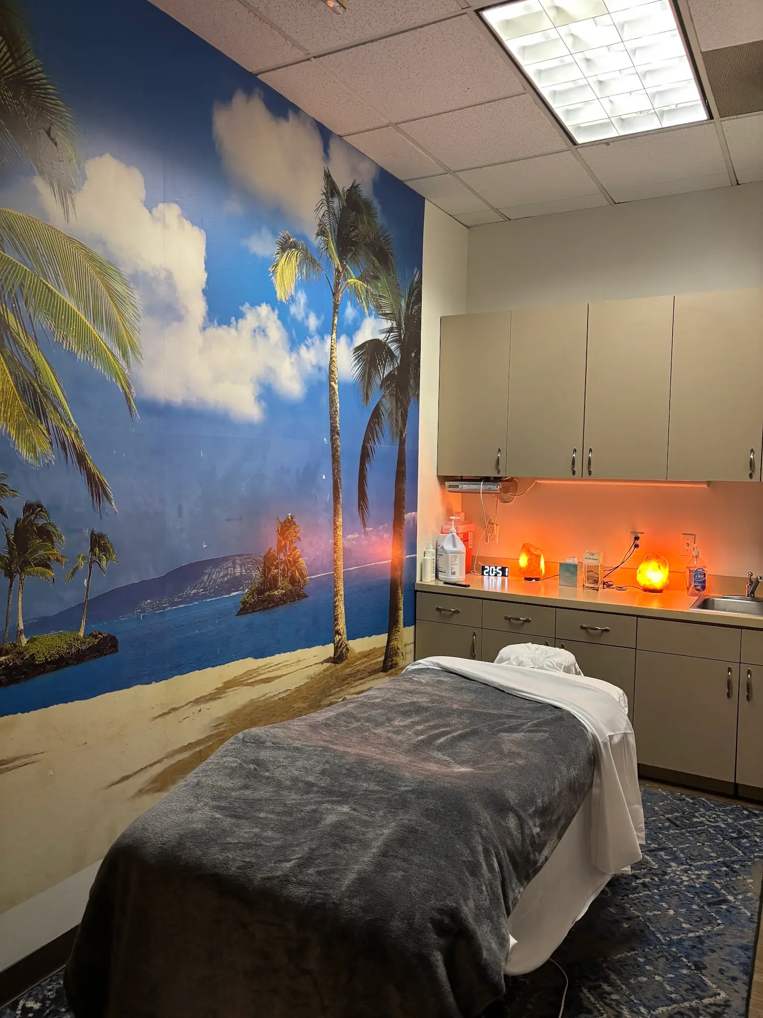 Massage room with a beach mural in Long Beach