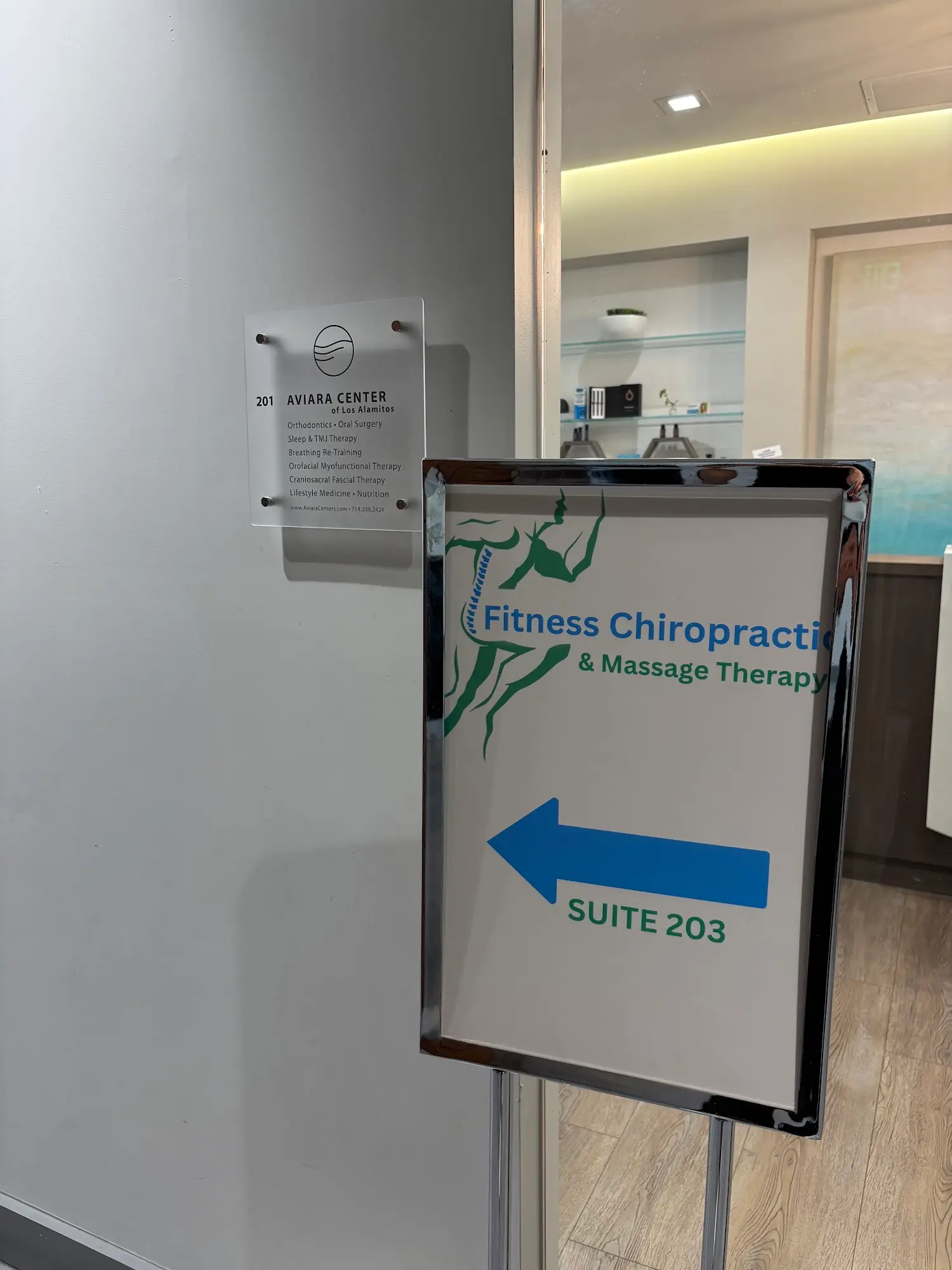 Sign pointing to Fitness Chiropractic in Suite 203