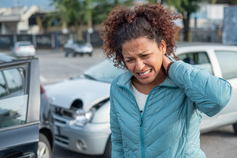 Girl with neck pain from whiplash